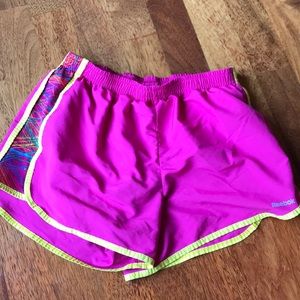 Reebok pink and yellow athletic shorts